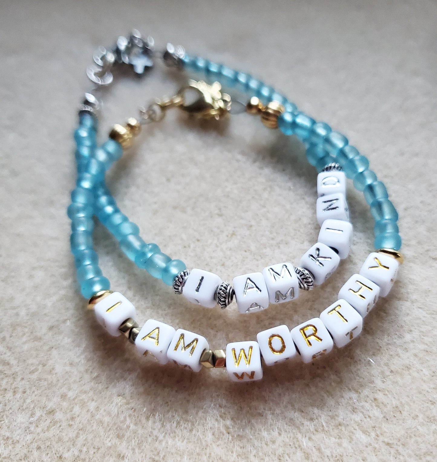 Aqua and gold single strand stackable Word bracelet