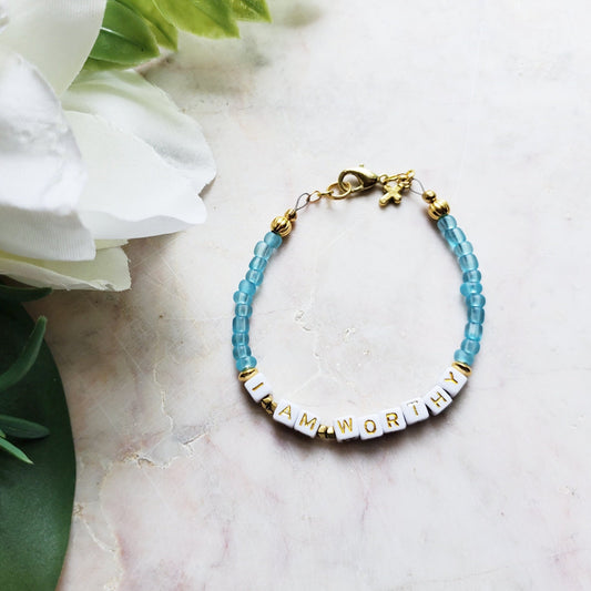 Aqua and gold single strand stackable Word bracelet